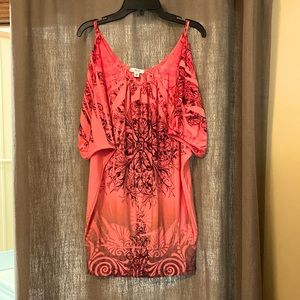 Blousy cold shoulder top w/ waist band.Rayon/polyester blend. Washes/dries well.